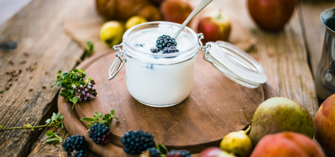 Breakfast food. Croissants on table with fresh fruit