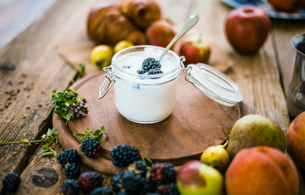 Breakfast food. Croissants on table with fresh fruit