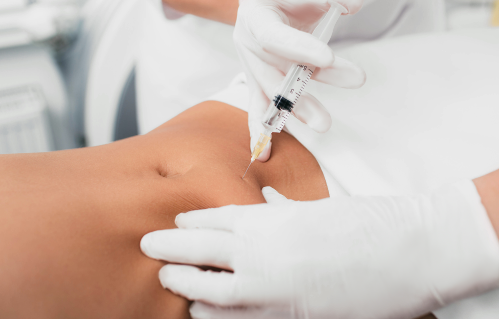 woman-getting-an-injection-in-her-tummy-close-up-2026-01-08-23-31-12-utc