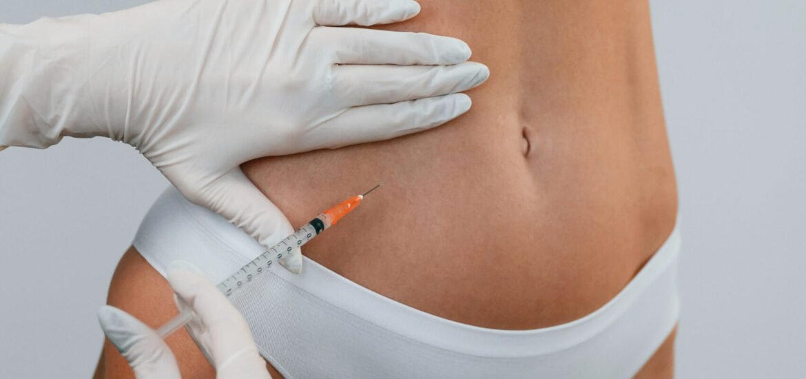 A woman standing indoors and doctor makes injections for rejuvenation. The concept of plastic surgery.